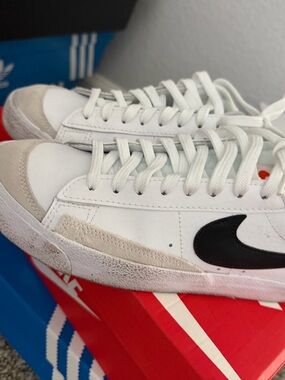 Nike White Sneakers with Black Swoosh and Cream Accents